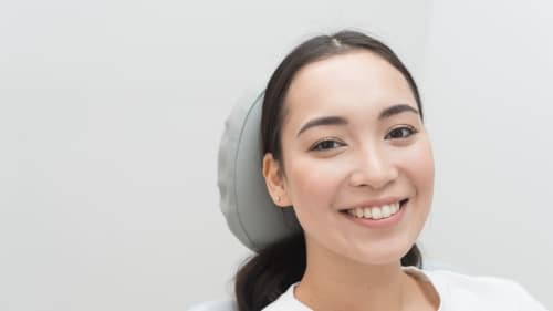 woman smiling at the dentist