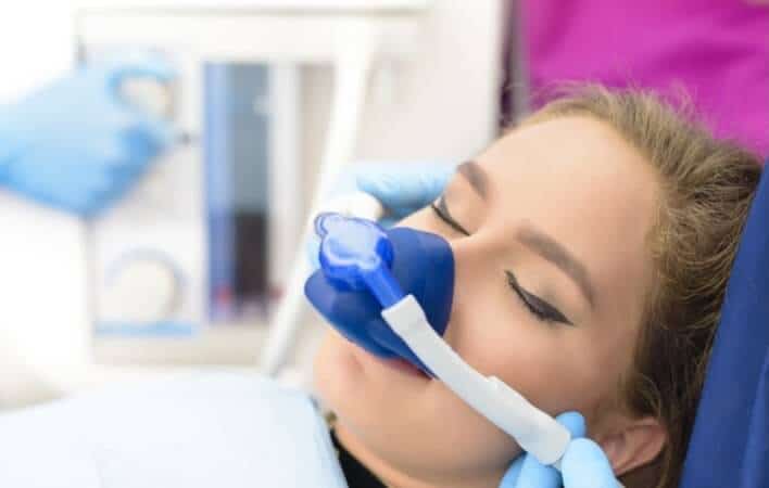 Woman getting nitrous oxide dentist office 2
