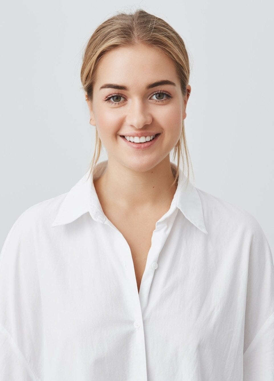 cheerful relaxed young woman with healthy teeth