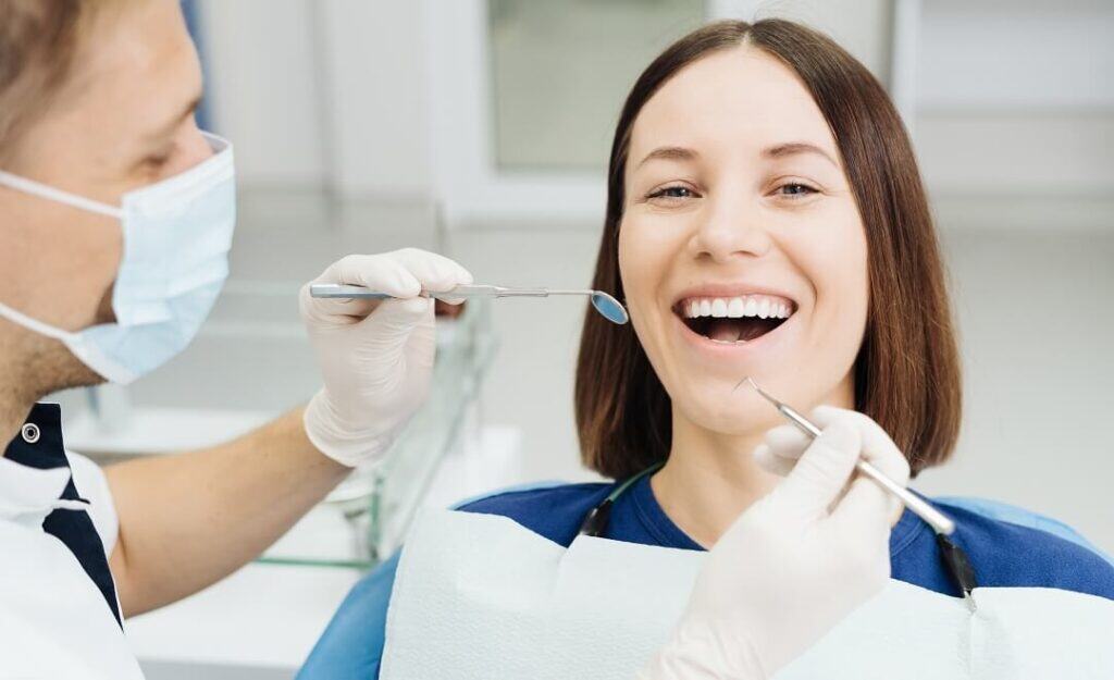 woman getting checkup at dentist