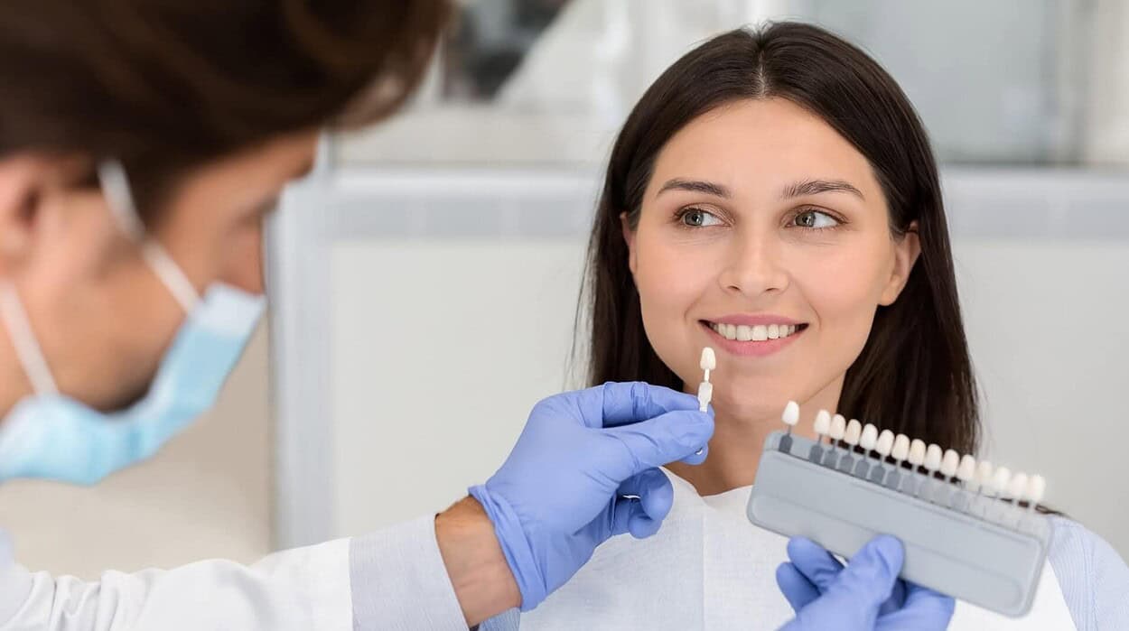 woman smiling after receiving dental restoration