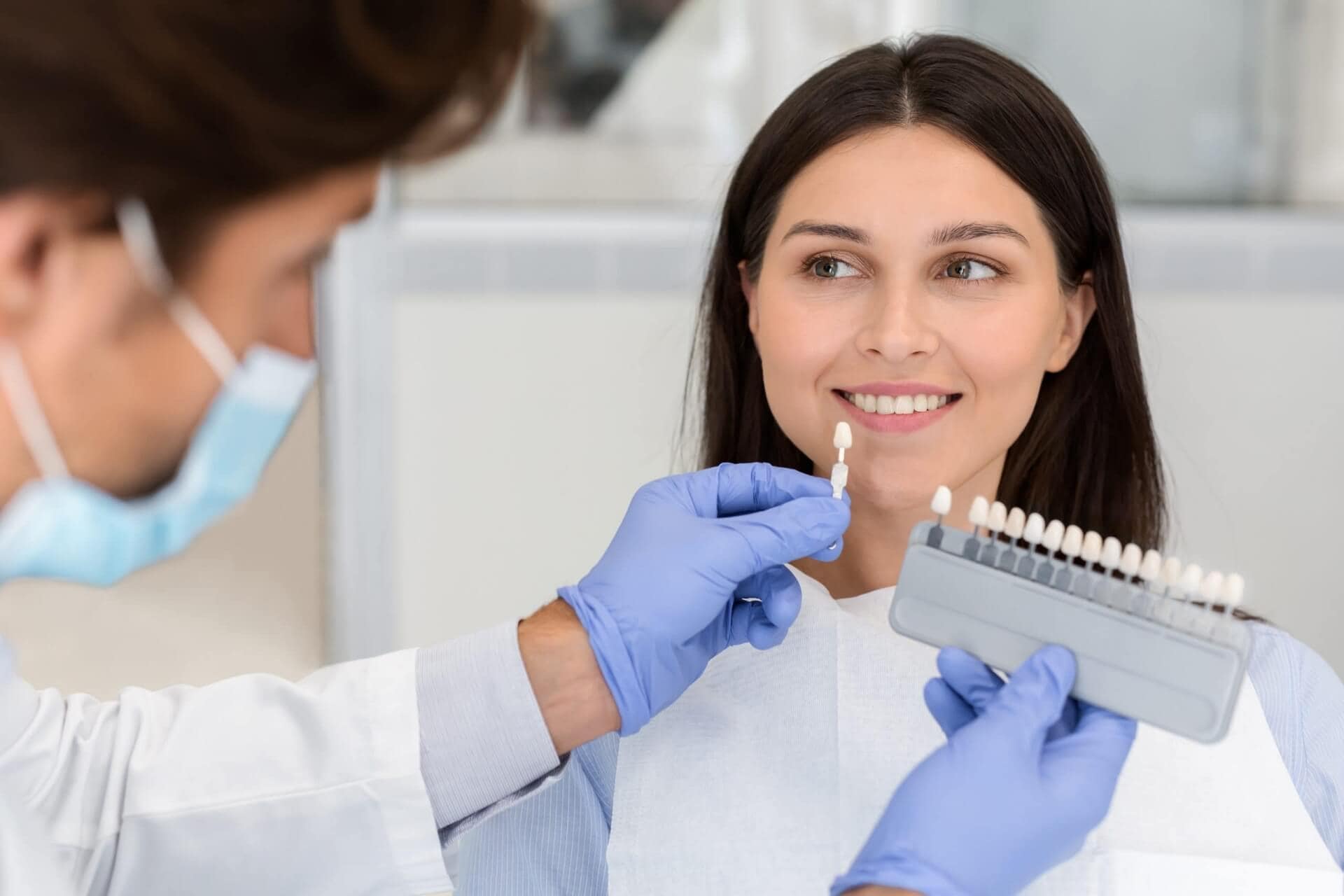 woman smiling after receiving dental restoration
