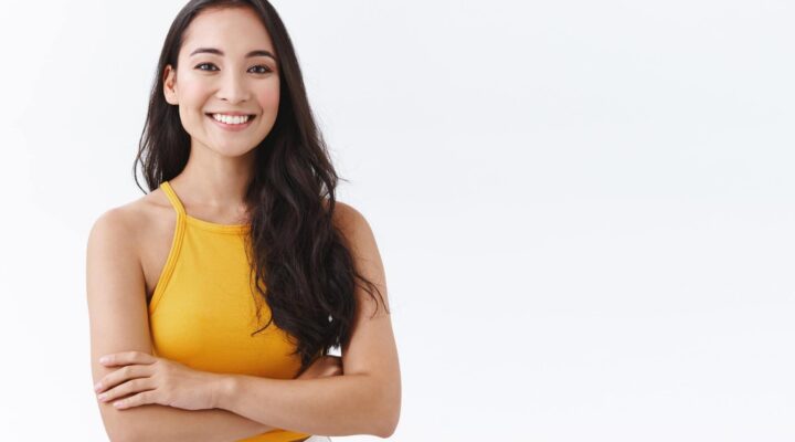 confident attractive smiling woman white background