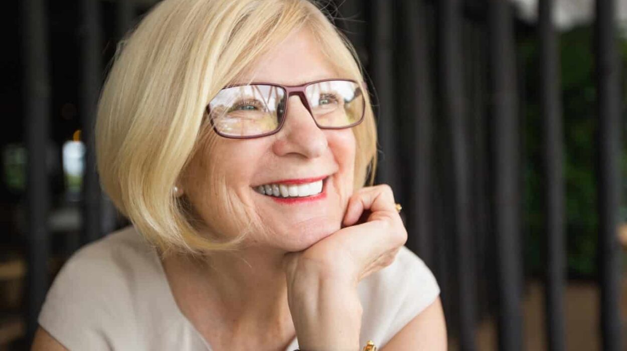 older woman smiling with all on 4 dental implants